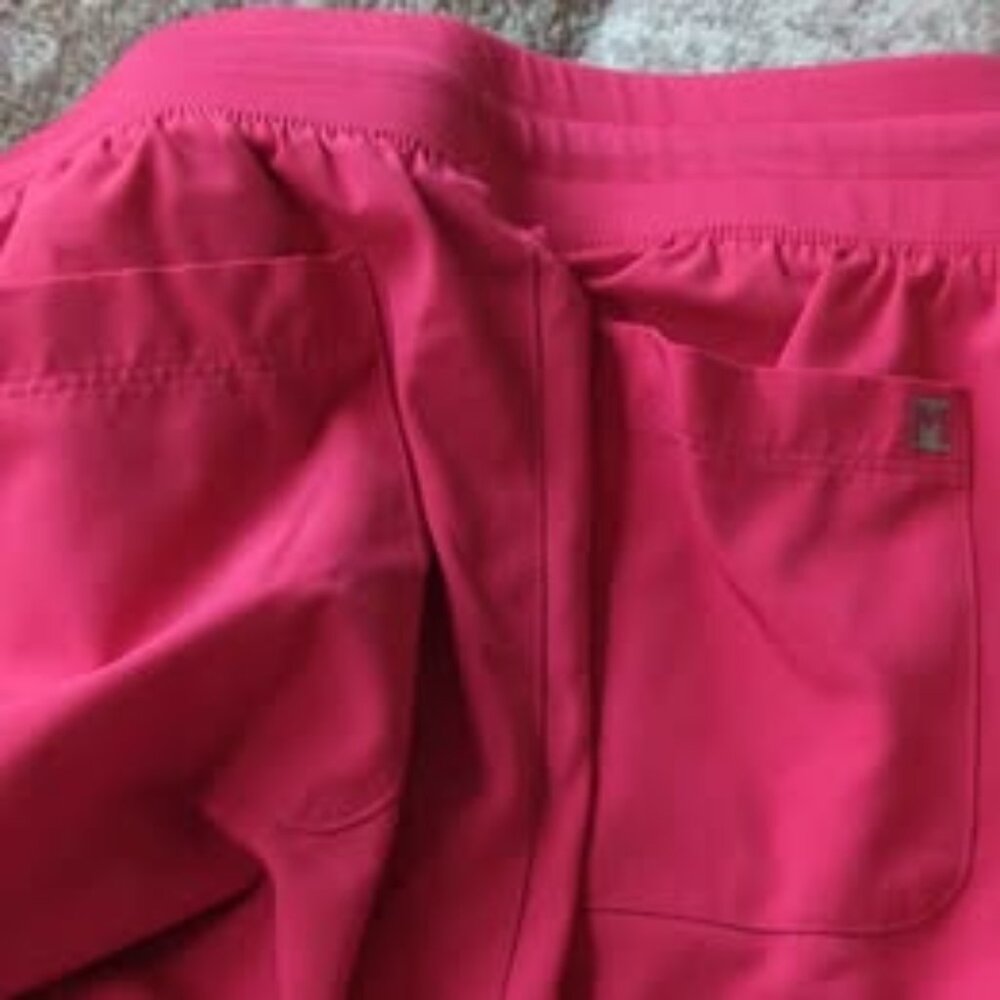 Maevn scrub pants coral in color